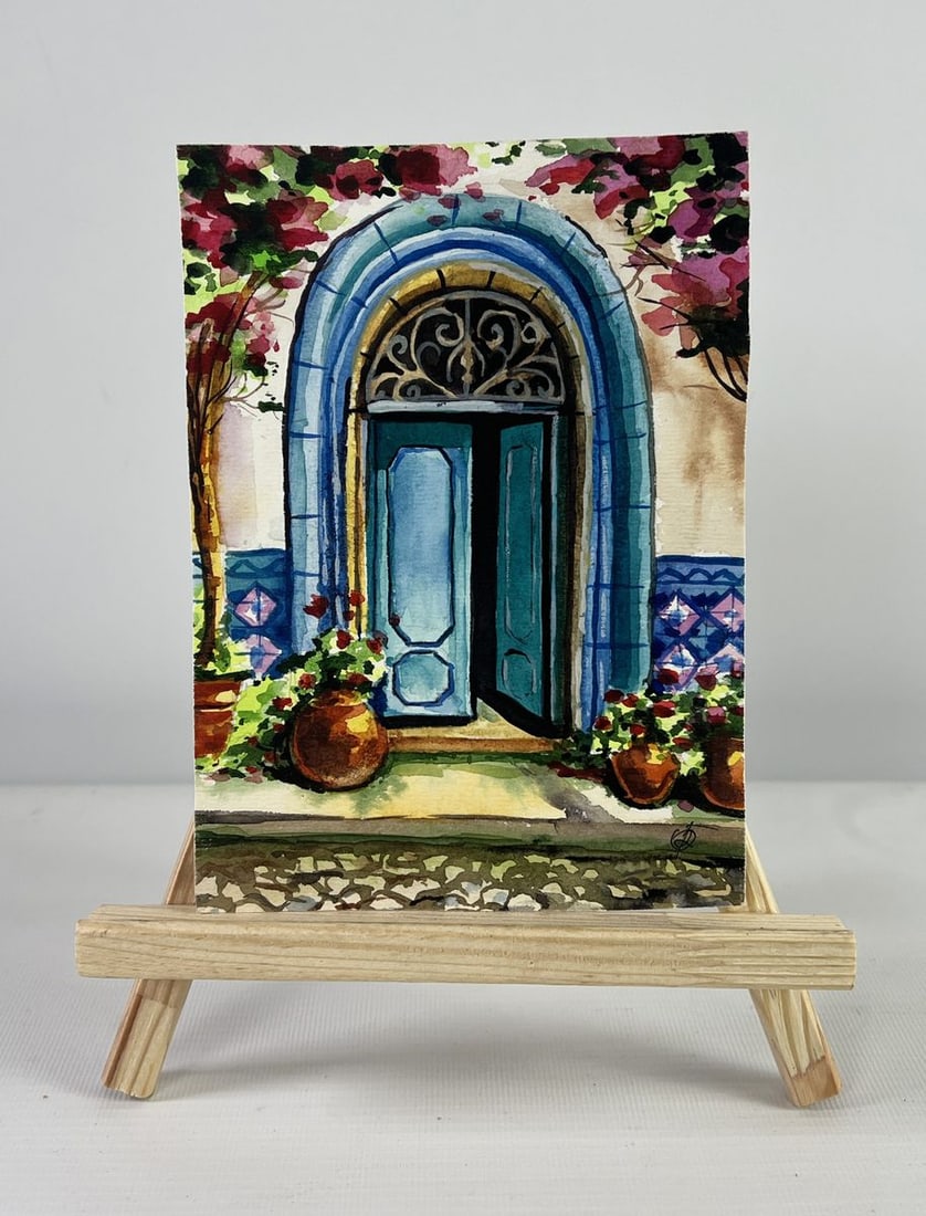 Watercolor painting Old building with blue door in alley Olga Ponomaryova: Title: Watercolor painting Old building with blue door in alley Olga Ponomaryova Description: №AAA5057 The watercolor painting on Paper titled "Old Building with Blue Door in Alley" is a vibrant