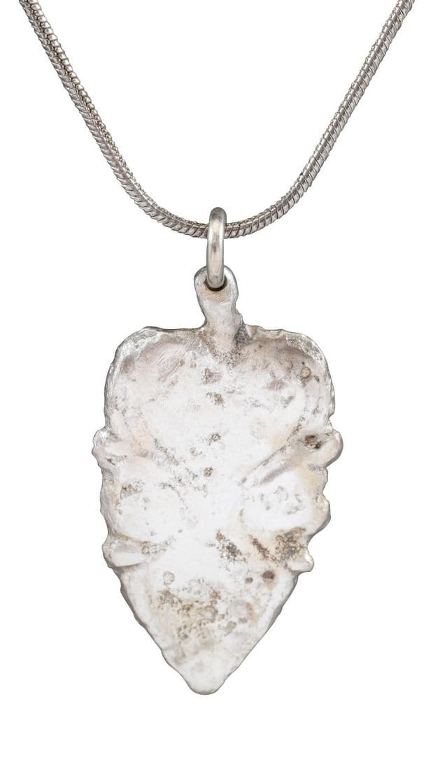 VIKING HEART PENDANT NECKLACE, 900 AD JEWELRY: An early example of large evolutionary form with a cusped top, formed from addorsed scrolling foliate continuing as a trefoil in the field. The trefoil was a favorite Viking form. The cusped top heart