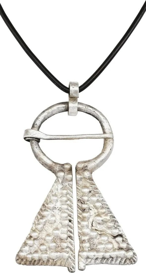 FINE VIKING PROTECTIVE BROOCH, C.950-1050 AD: Large example, over 2 1/8" height of omega form. Oval top with large triangular terminals with pellet triangles within roped borders and mirror image pellet arrangements, probably with supernatural ce