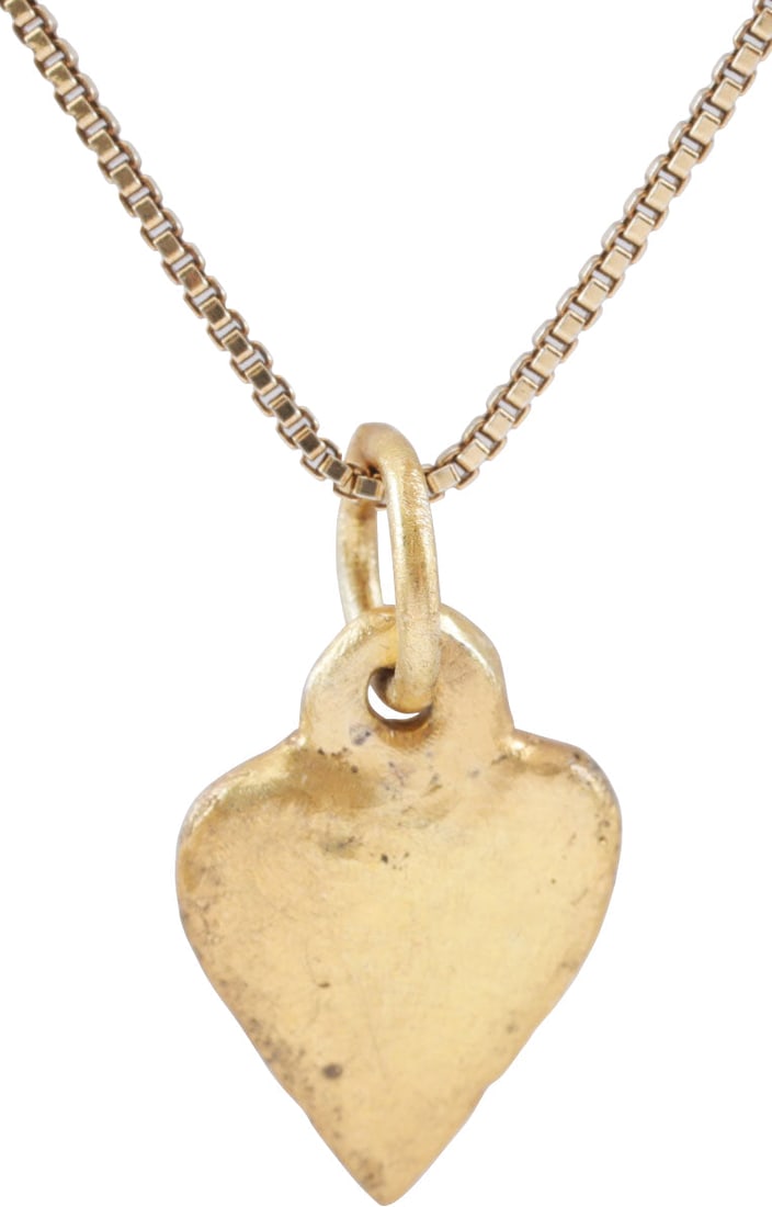 VIKING HEART NECKLACE C.950-1050 AD: C.950-1050 AD. Just under 1/2" (0.49") height of cusped heart form and low rounded section with a nub at the bottom. The Viking heart in its purest form! Surface has worn from wear (1000 years ago!) a