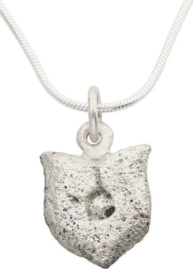 MEDIEVAL LADY'S NECKLACE PENDANT C.1300-1450: Under 3/4 " height, silvered bronze. Shield with a central keyhole motif impressed, probably an armorial device from the family arms of the owner who would have been of the noble class. The pendant wo