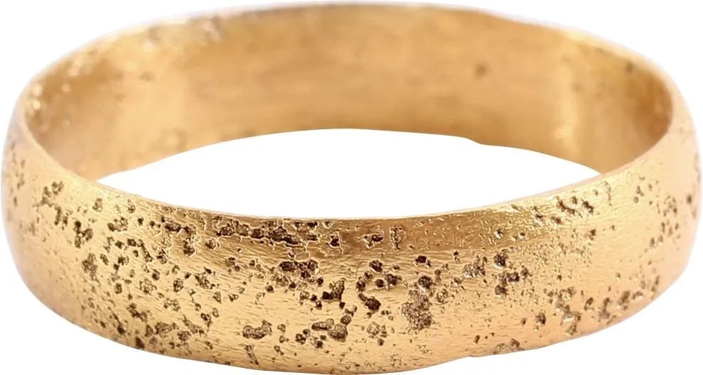 VIKING WOMAN’S WEDDING RING, 866-1067 AD, SIZE 9 1/4: Silvered bronze, fine wearable size 9 1/4. Rounded face. 4.7mm in width. Surface was lightly textured from burial and restored in 24karat gold. Vikings exchanged rings on the pommel of the groom's swo