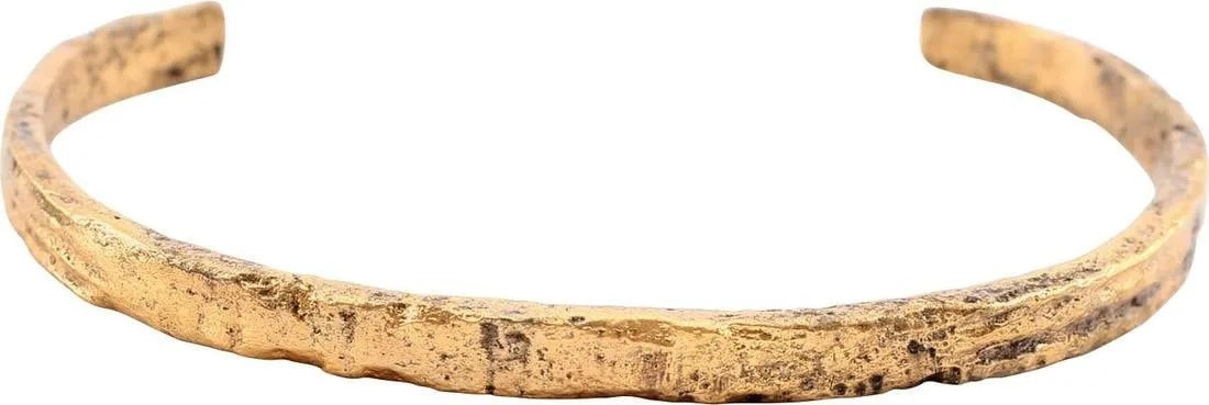 ANCIENT ROMAN BRACELET, 1ST-2ND CENTURY AD: Gilt bronze, C form, of thick section with flat face and sides. 5.0mm uniform width with the tips only slightly tapered with transverse band decoration. The center with a matching segment flanked by r