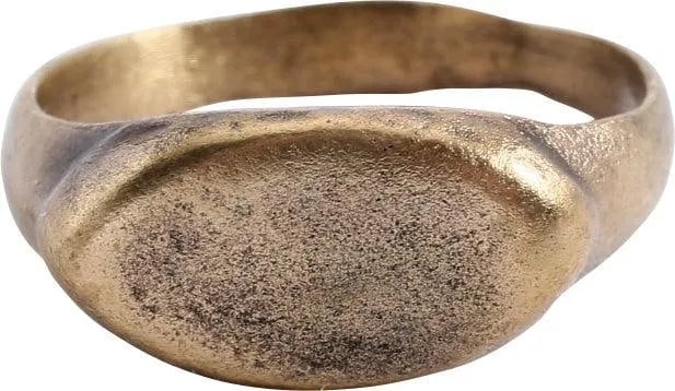 FINE VIKING WARRIOR'S RING, 10TH-11TH CENTURY AD, SIZE 8 1/2: Gilt bronze, size 8 1/2 with 3.3mm well-rounded band slightly flared to the shoulders. Raised lenticular bezel with slightly domed top. Professionally refurbished with the 24karat gold overlay