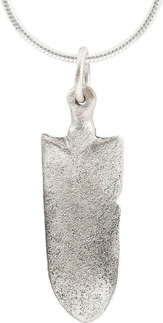 MEDIEVAL NOBLE WOMAN'S NECKLACE PENDANT: Silvered bronze. Shield shaped, specifically as a horseman's or knight's shield with substantial coverage at the top and tapering to lay along with the horse's girth. The center with a stylized