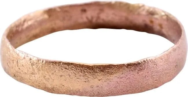 VIKING WEDDING RING 866-1067 AD, SIZE 9 1/4.: Danelaw England. 3.4mm width with low rounded face. Made with a central core to distribute the molten metal and heat. The core was then laboriously removed by hand with the remnants still visible.