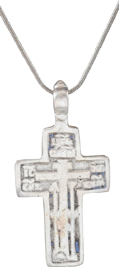 FINE EASTERN EUROPEAN CHRISTIAN CROSS NECKLACE: 17th-18th century, Orthodox rite. Silvered bronze, just under 2 1/4" (2.21”) height including the suspension loop. High relief decoration with raised borders and central cross with inscriptions