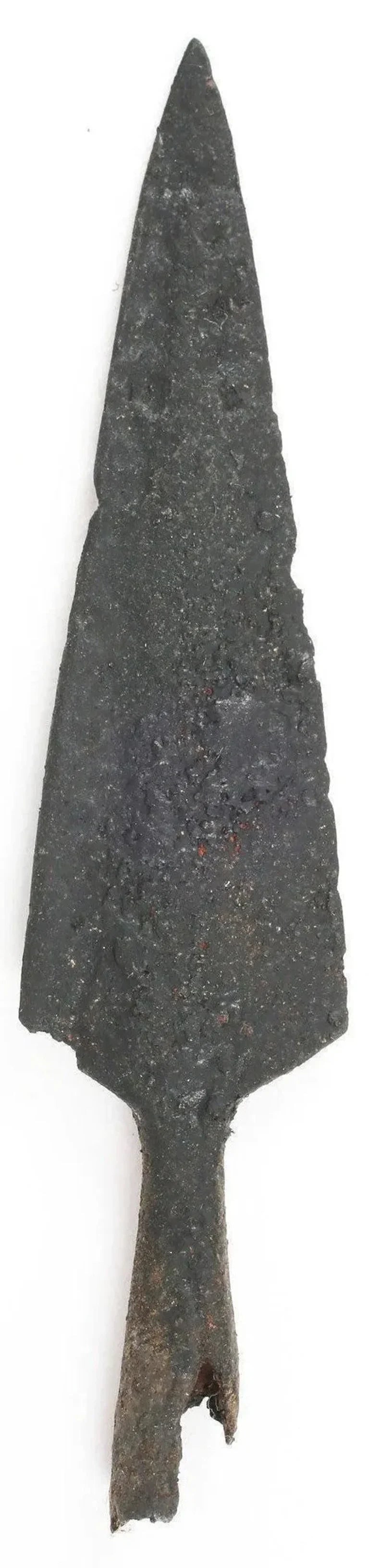 VIKING SOCKETED ARROWHEAD, 9th-10th CENTURY AD: Forged iron with 3 1/2" length with tapered butted seam socket, the bottom edge irregular from burial The point with low raised medial both sides. Stable professionally conserved condition. Exceptiona