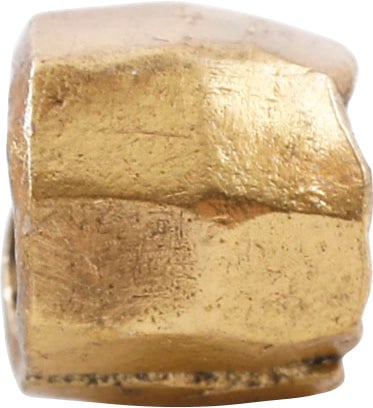 VIKING GILT BEAD, 9TH-11TH CENTURY AD: 6.2mm in length, 1/4 inch. Hand formed from bronze, forged to a hexagonal section with the center swelled to a ridge. Butted seam. Professionally refurbished with the 24karat gold overlay restored.