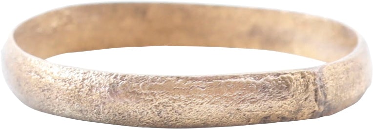 VIKING WEDDING RING, 10TH-11TH CENTURY, SIZE 10 ¼: Bronze, with a 24karat gold surface, professionally restored. See the reference image which shows the process. Rounded face band, 3.1mm wide. Surface textured from burial. Jewelry gift boxed with cert