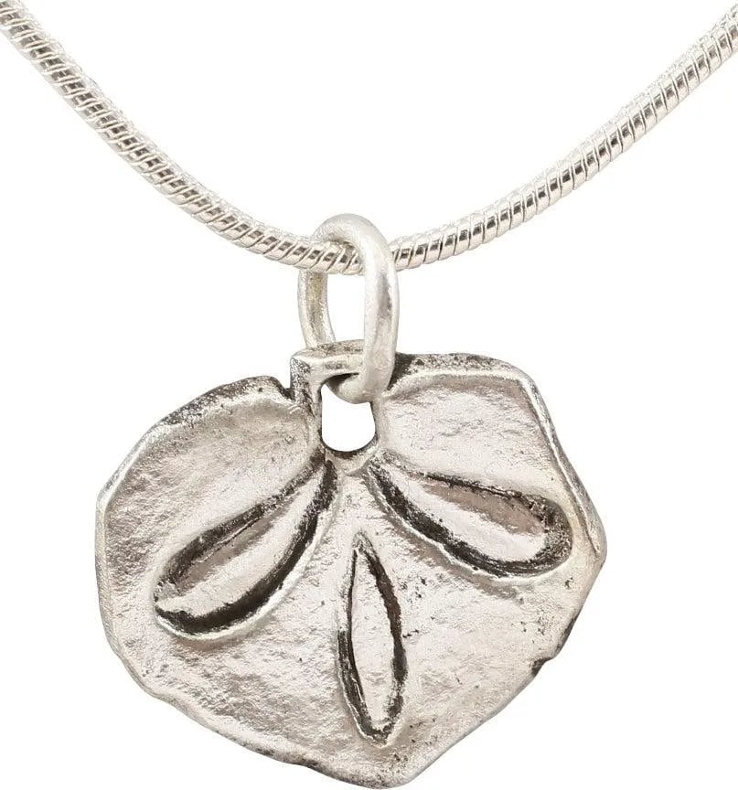 FINE VIKING HEART PENDANT NECKLACE, 9TH-10TH C.AD: Silvered bronze. Over 5/8" width with a slightly raised edge defining the cusped top heart, slightly distorted to accommodate the figural center. The field with a well-delineated foliate trefoil