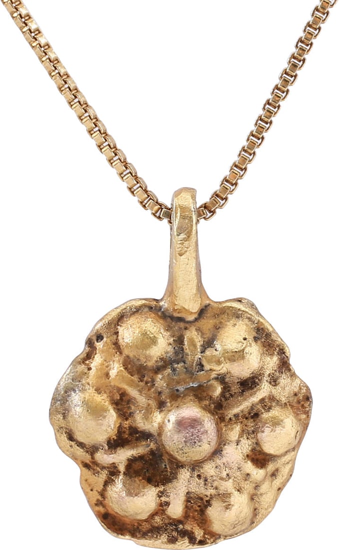 ROMAN/BYZANTINE WHEEL OF FORTUNE NECKLACE, 5th-8th CENTURY AD: The period of the pilgrimages to the Holy Land. Over ½” width modeled in high relief as a central dome with six radials, alternating with similar smaller domes. Based on the earlier Roman