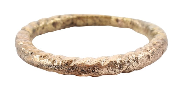 FINE VIKING TWISTED RING C.850-1050 AD, SIZE 7: Size 7 with the twisted top, 2/3 its circumference tapering from the 2.1mm bottom to 2.7mm top. Good quality delicately made example. Surface textured from burial and professionally refurbished with