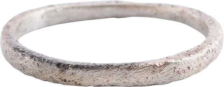 ANCIENT VIKING WEDDING RING, SIZE 7 1/4: 10th-11th century AD. Slightly rounded face band. 2.3mm width. Wearable size 7 1/4. Vikings exchanged rings on the pommel of the groom's sword. Surface textured from burial. Professionally
