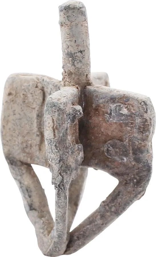 LATE MEDIEVAL DREIDEL, 16th-17th CENTURY: Over 7/8" in height. Heavy lead-based alloy. Four veins, each with an angled open bar below converging to form the point. Each vein with Hebrew ciphers on each side. Tapered grip to the top. Some