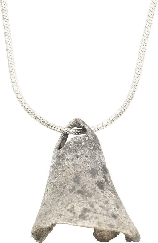 CELTIC VOTIVE BELL NECKLACE 7th-5th CENT BC: Bronze, 7/8” height, delicately cast with integral suspension loop. Generally acknowledged as exchange objects (money) these frequently, as here, are encountered with pieces chipped out. Specifi