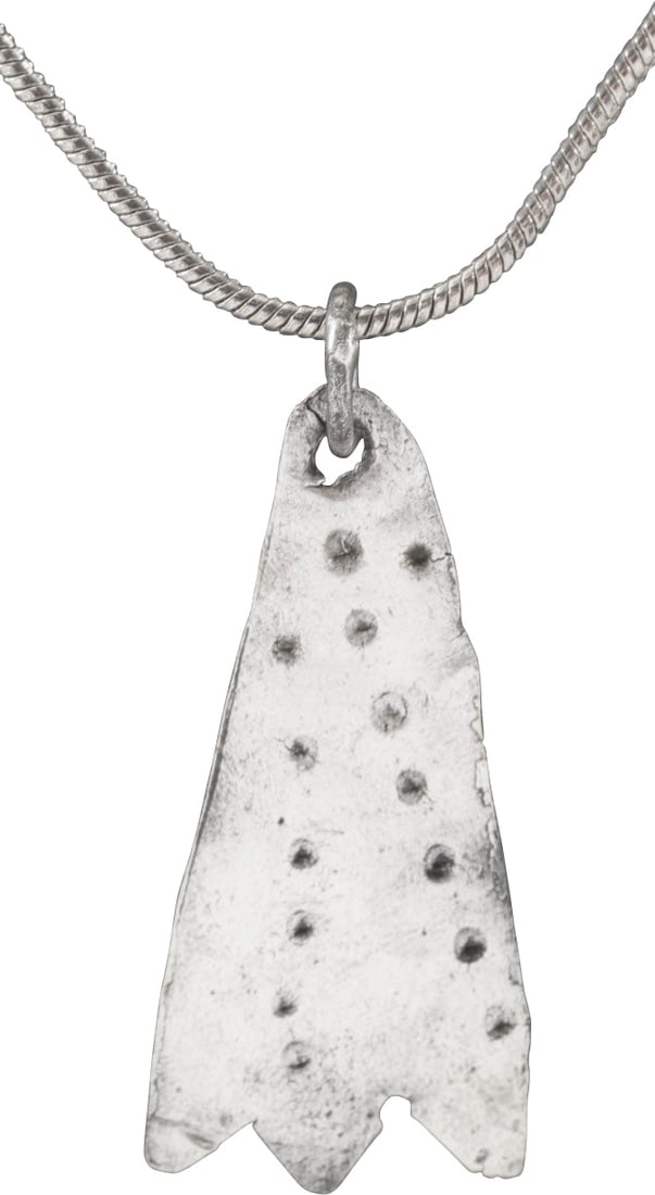 VIKING SORCERESS'S AMULET, 9TH-11TH CENTURY AD.: 10th-11th century AD. Just over 1" (1.06") in height. Bronze, originally silvered, is shaped like a duck's foot with concentric circular motifs on the surface, simulating scaly skin. A burial at Viden