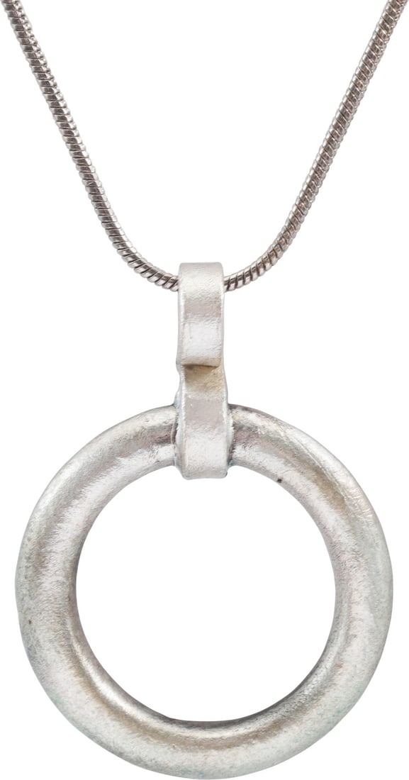 CELTIC PROSPERITY RING NECKLACE: Worn in numbers on the surface of the jerkin, these small metal brooches provided a measure of protection against sword cuts and, in fact, were a form of armor. See current Public Television programmi