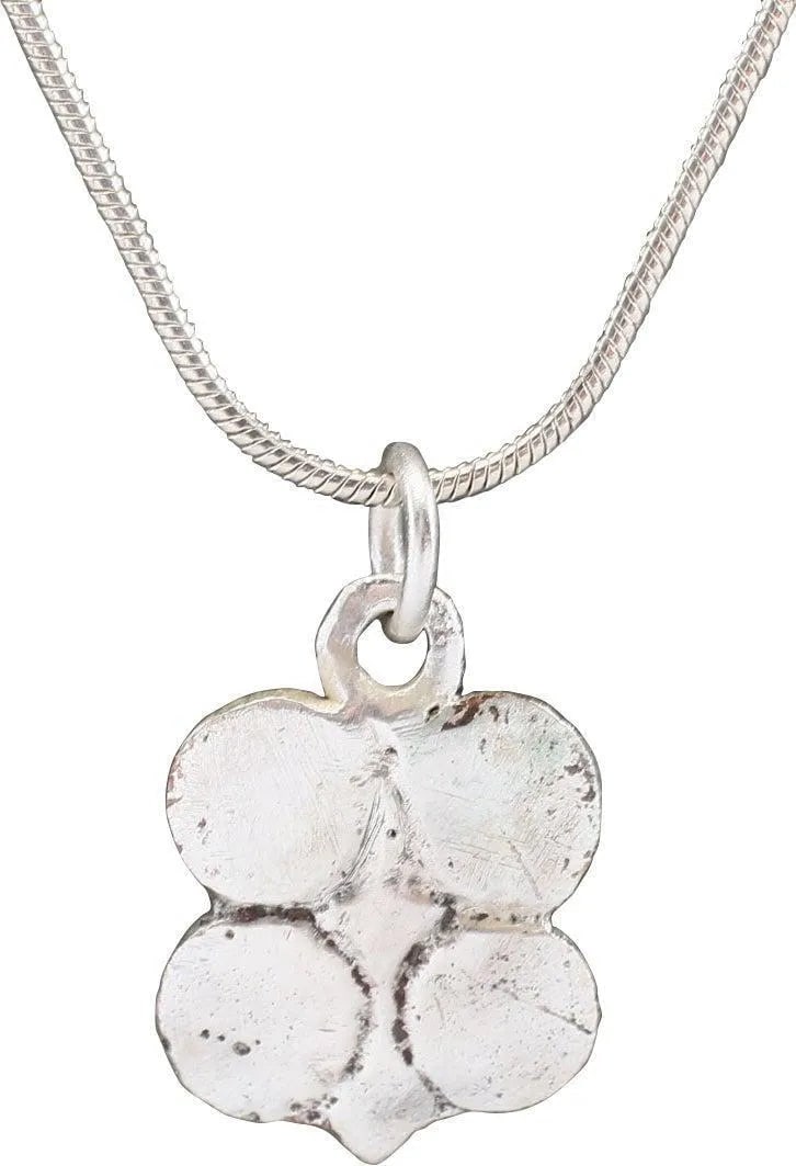 ANCIENT ROMAN QUATREFOIL PENDANT, 1st-2nd C.AD: Silvered bronze. Just under 3/4" height, shaped as a quatrefoil with four incised circles to each quarter and a central diamond addorsed with another below. Professionally refurbished with the silver