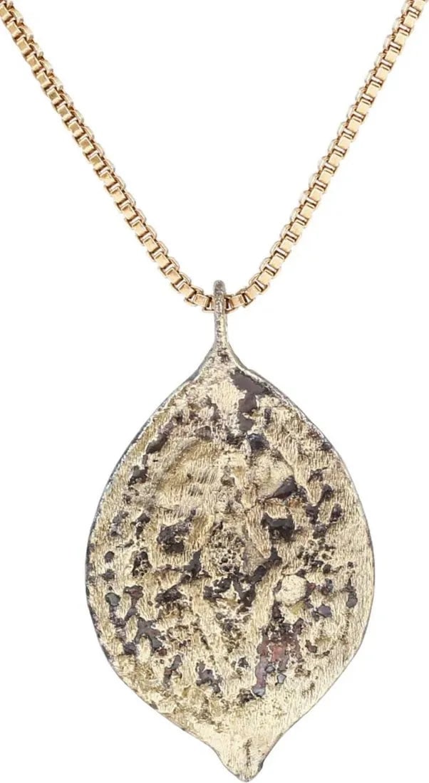 ITALIAN WOMAN'S PENDANT, C.1450-1650: Gilt bronze, over 7/8" total height. formed as four circles in an oval border. This form is thought to derive from the Medici family coat of arms. The Medici coat of arms displays five circles and is