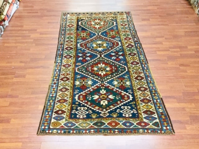Antique Kazak Caucasian rug-4686: Title:Antique Kazak Caucasian rug-4686 Description:Colorful antique Persian Kazak Caucasian from southwest Caucasus, size 4 ft by 9 ft. 5 inches, circa 1900 on light blue field, excellent condition wi