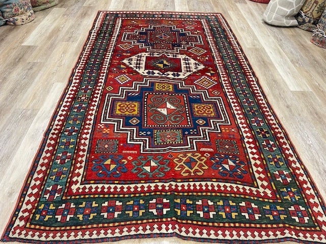 Antique Three medallions Kazak Caucasian Rug-3082: Title:Antique Three medallions Kazak Caucasian Rug-3082 Description:The Antique Three Medallion Kazak Caucasian Rug-3082 is a handmade, hand-knotted rug originating from Azerbaijan around the time per