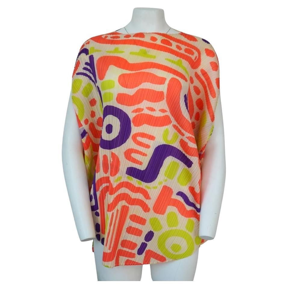 Pleats Please Issey Miyake Multi Color Top: Pleats Please Issey Miyake Multi Color Top Size 5 The top is slightly asymmetrical, adding to the unique and colorful pattern. Great overall condition, no obvious signs of wear. Reserve: $440.00 Shipp