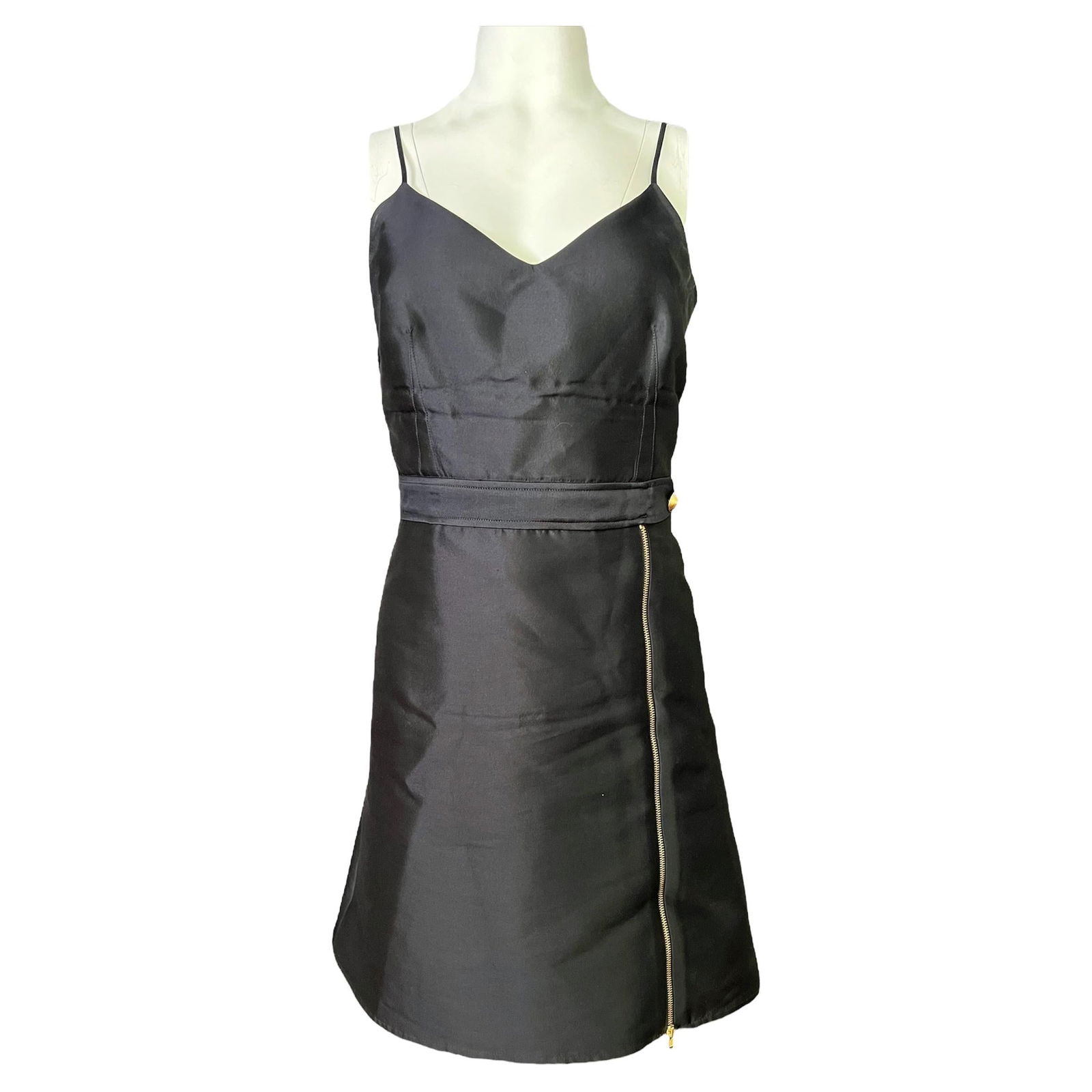 Harvey Faircloth Navy Mini Dress, Size 4: Shiny navy finish Gold tone hardware Spaghetti straps V neckline Mini Length Zipper and button details Reserve: $440.00 Shipping: Domestic: Flat-rate of $85.99 to anywhere within the contigu