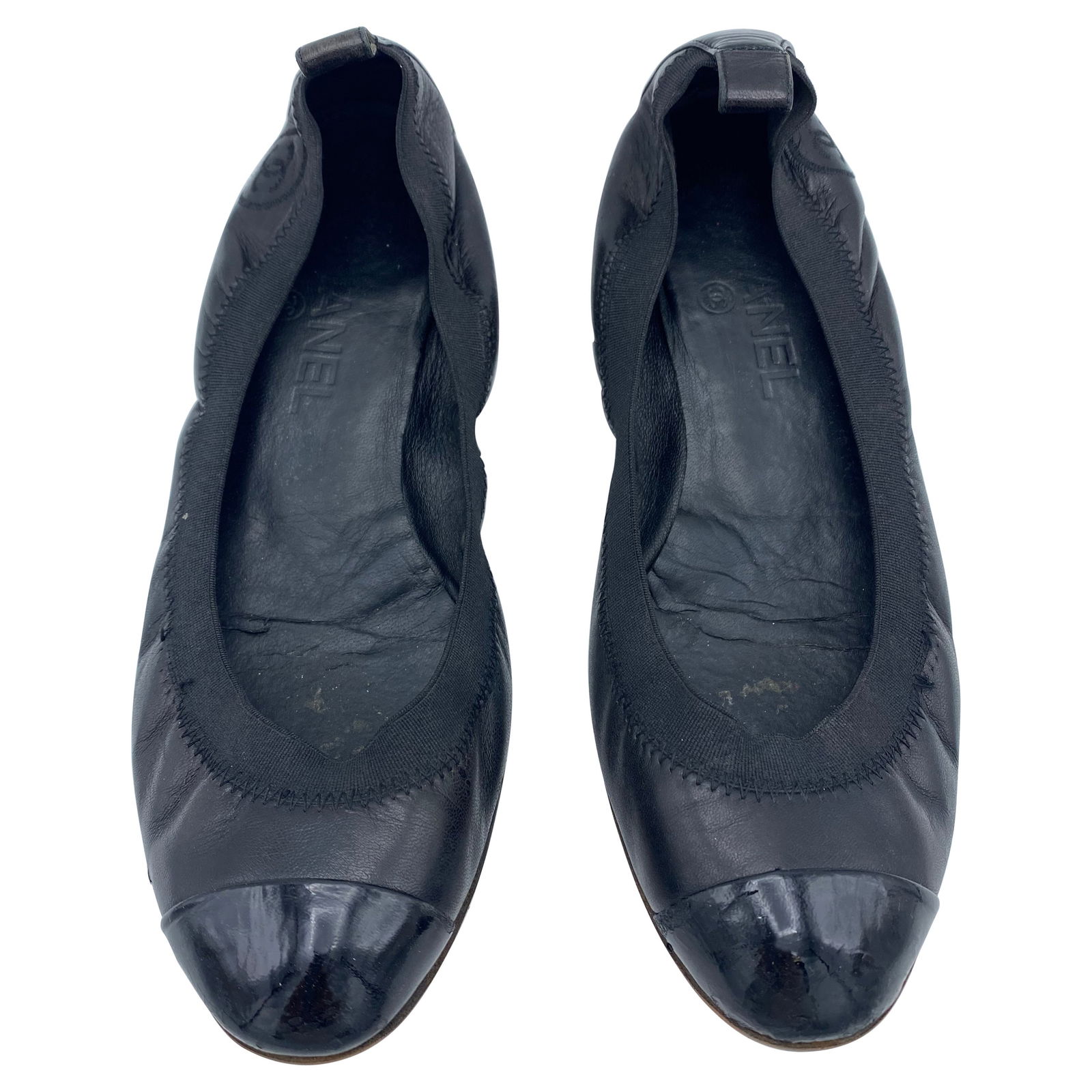 Chanel Black Leather Ballet Flat Shoes, Size 38: Product details: The flats feature black leather with black elastic around the foot and CC stitched on the outside of each foot, Reserve: $400.00 Shipping: Domestic: Flat-rate of $85.99 to a