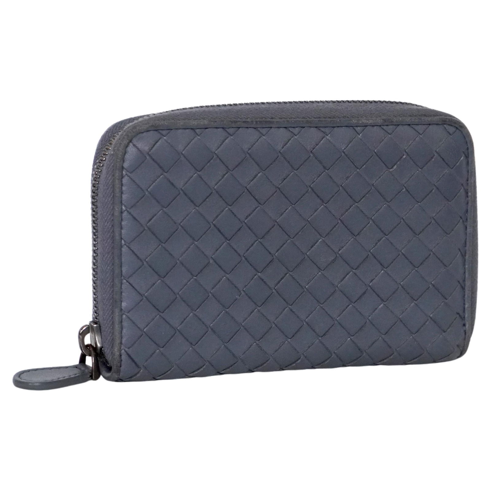 Bottega Veneta Intrecciato Weave Leather Wallet: Bottega Veneta Intrecciato weave zip-around leather wallet in the color Slate. Slate is a pale blue shade. Featuring a top zip fastening, multiple interior card slots, a main internal compartment, a