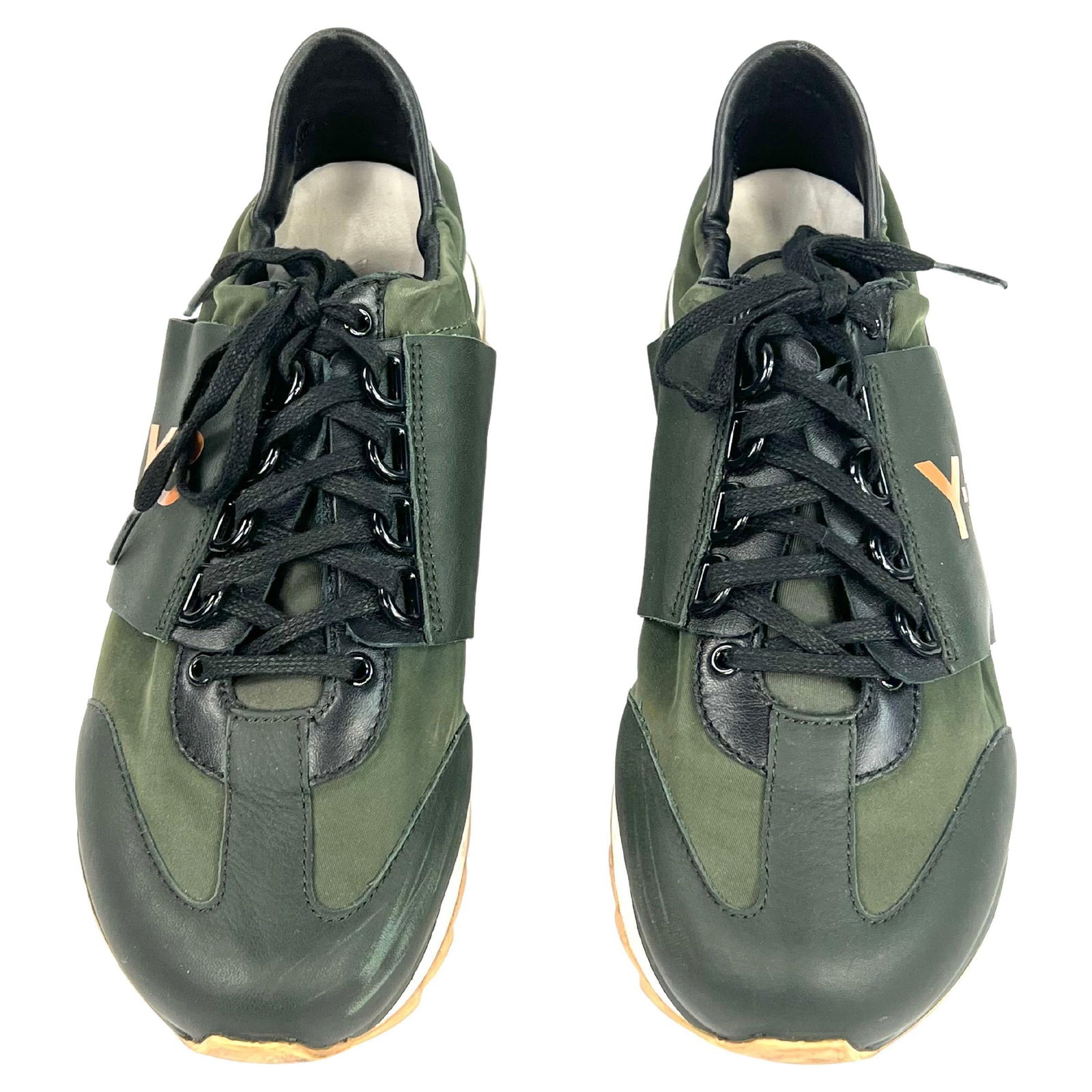 Y-3 Rhita Sport Green Trainers Sneakers, Size 7: Product details: The athletic sneakers are made out of green leather and nylon, featuring laces fastening and orange signature Y-3 brand sign on outer sides. Comes with the original box. Reserve: $360