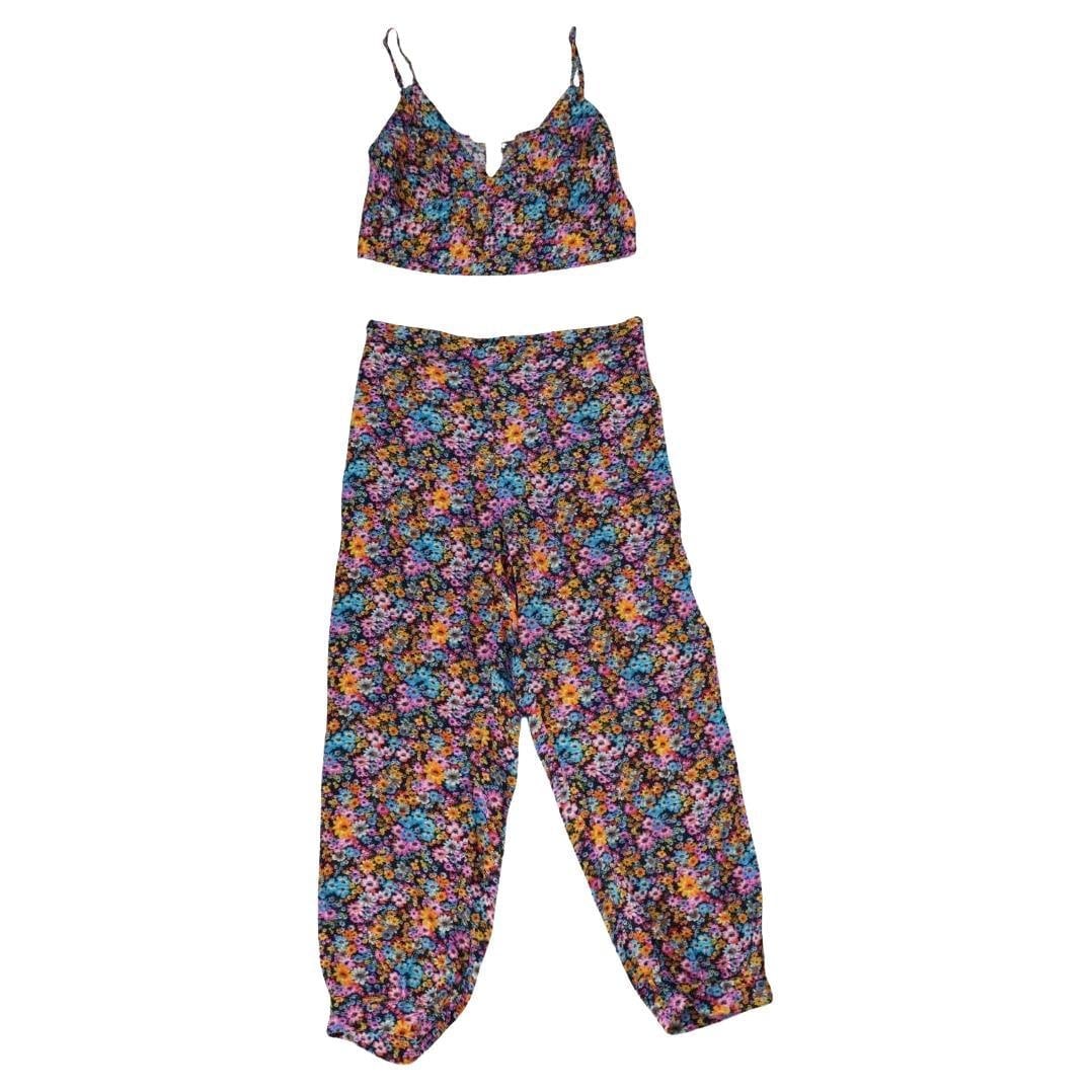 Stella McCartney Christelle Floral Silk Set: Stella McCartney Christelle Floral Silk 2-piece set Cropped tank top with adjustable straps The pants have a banded waist with elasticized back panel Pull-on style Waist slip pockets Tapered
