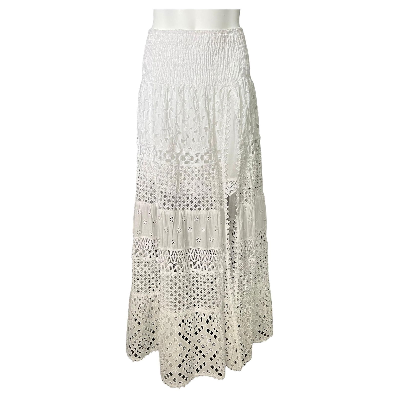 Temptation Positono White Cotton Maxi Skirt: The skirt features lace finish with floral pattern Floor length Side slit detail Reserve: $360.00 Shipping:Domestic: Flat-rate of $85.99 to anywhere within the contiguous