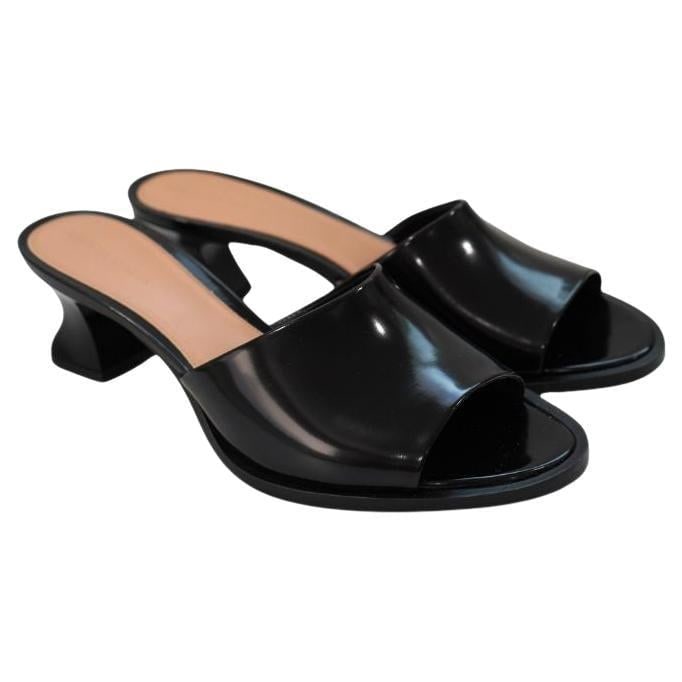 Bottega Venetta Black Cha Cha Mini Leather Mules: Bottega Venetta Black Cha Cha Mini Leather Mules sz 41 New with box and dust bags Heel height: 2.5” Reserve: $392.00 Shipping: Domestic: Flat-rate of $85.99 to anywhere within the cont