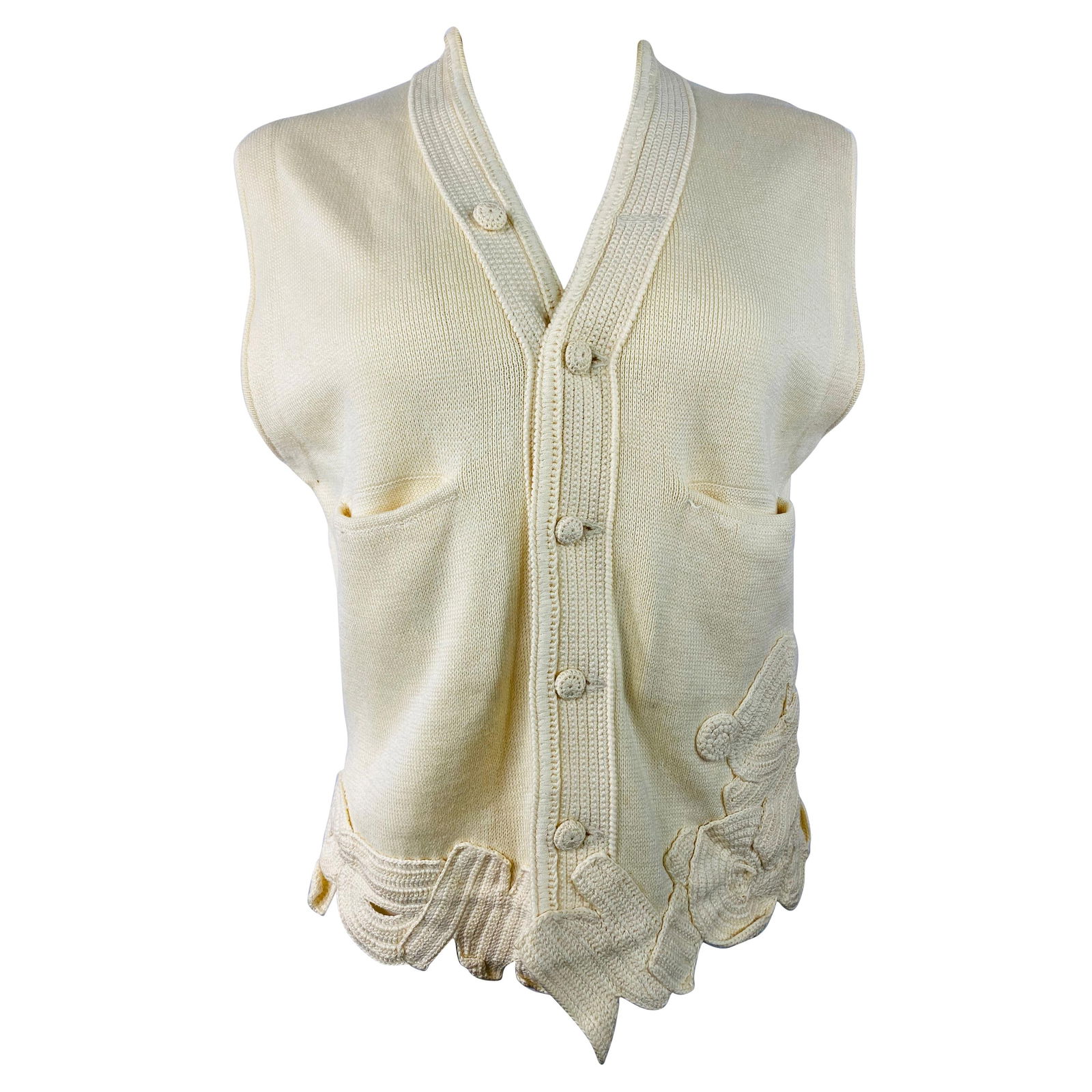 Matsuda Nicole Tokyo Ivory Knit Vest: Product details: Featuring 100% cotton, ivory/ cream color, front button down closure, dial front pockets, knit letters detail on the bottom, v neck, sleeveless. Reserve: $392.00 
