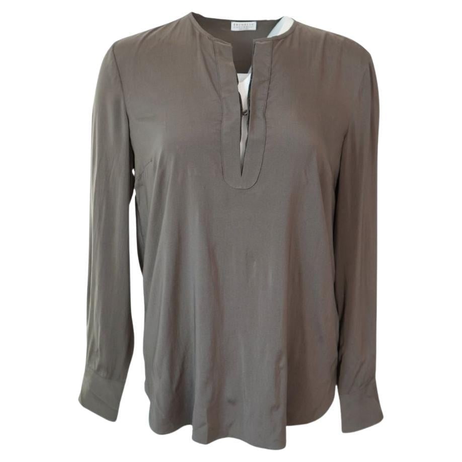 Brunello Cucinelli Olive Long Sleeve Silk V-neck Blouse: Brunello Cucinelli Olive Long Sleeve Blouse Size M Bust 41" Waist 41" Length 27" V-neck with button closure Good overall condition Reserve: $276.00 Shipping: Domestic: Flat-rate of $85.99 to