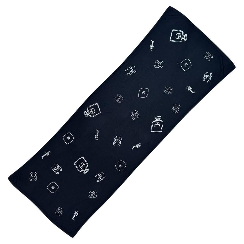 Chanel No. 5 Black Cashmere Scarf: This Chanel scarf is made of 100% cashmere. Has embriodered "Chanel", CC logo, and Chanel No. 5 perfume bottle. Length 76” Width 26” It has some repairs from moth damage. The repairs are