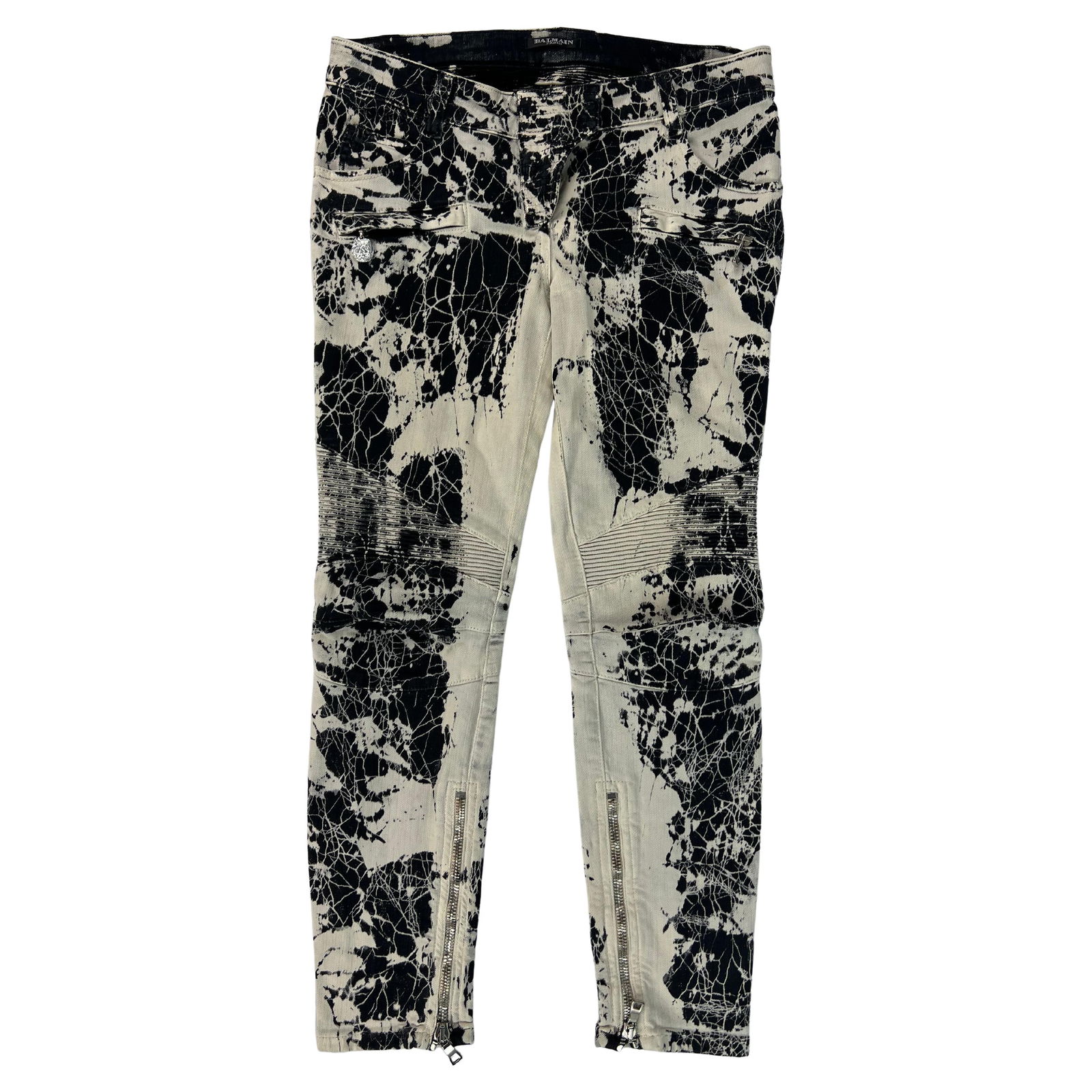 Balmain Black and White Denim Jean Pants, Size 40: Product details: The pants feature black and white grafitti print with silver tone hardware. It features skinny design with low waist fit. Reserve: $792.00 Shipping: Domestic: Flat-rate of $