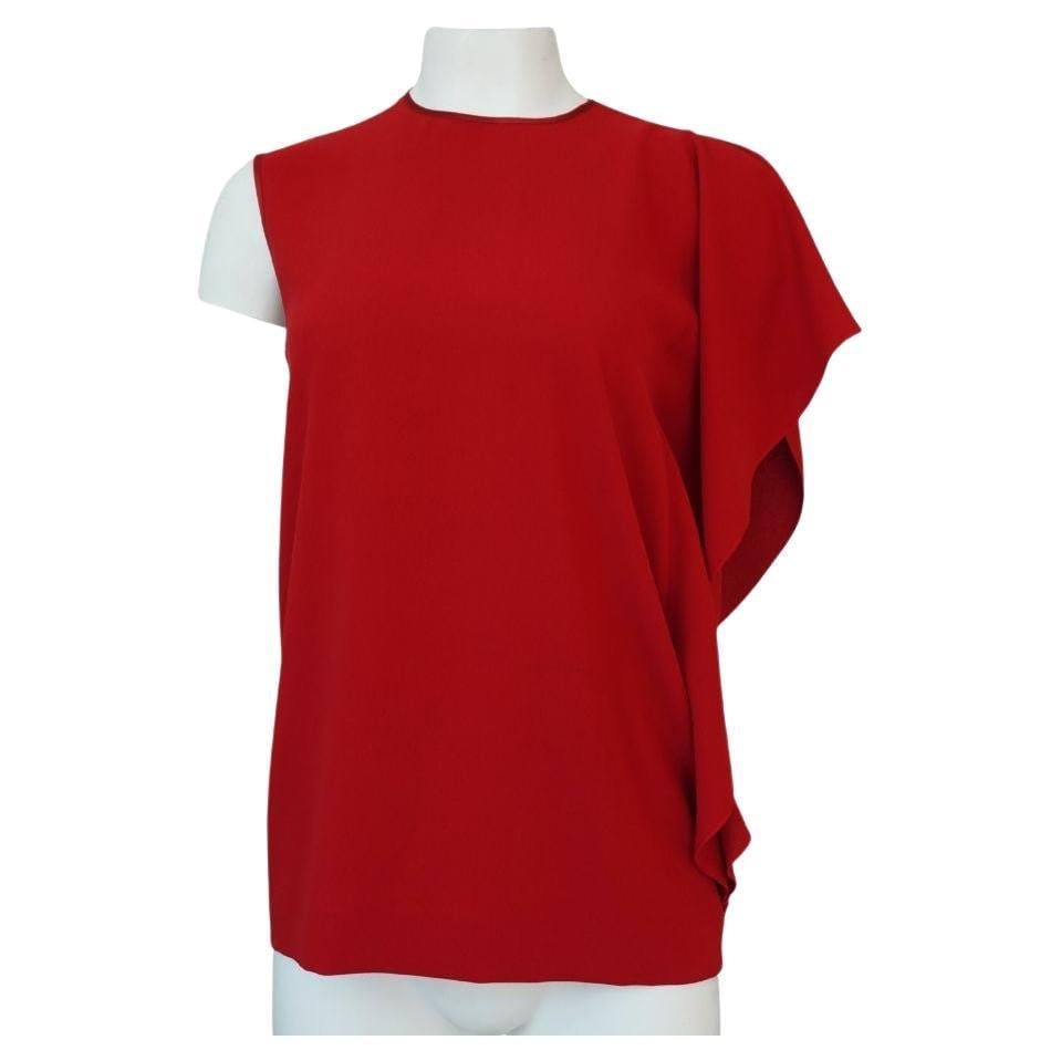 Maison Margiela Red Asymmetrical One Sleeve Top: size 40 Bust 38" Waist 40" Length 26.5" Left sleeve that beautifully drapes Back zipper closure Great overall condition, no obvious signs of wear Reserve: $520.00 