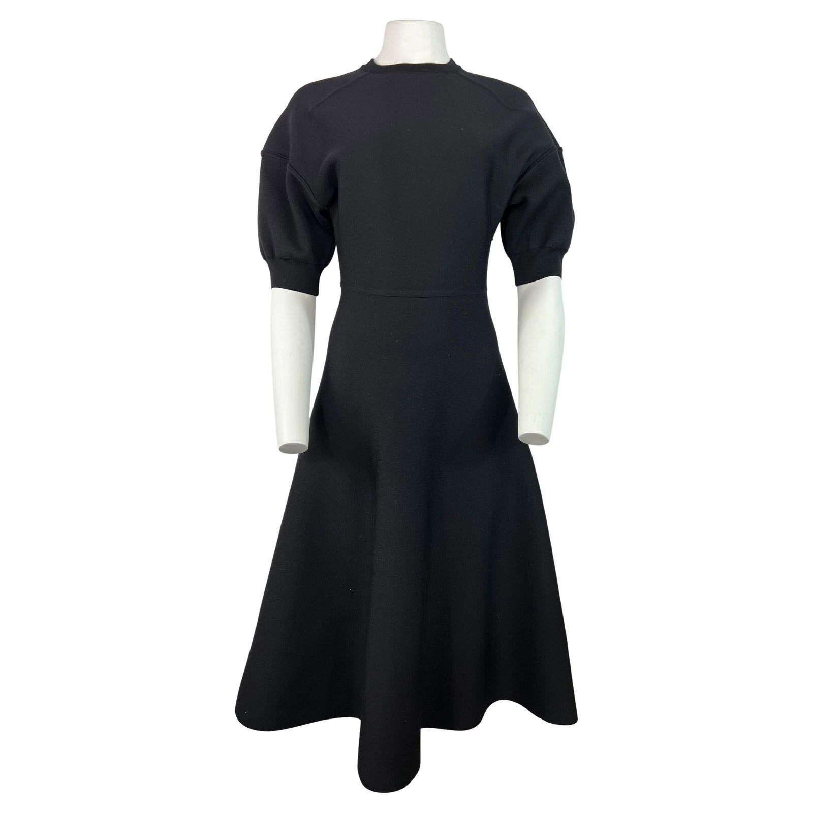 Christian Dior Black Wool Midi Dress, Size 6: Product details: The dress features crew neck line, short balloon sleeves, midi length flare skirt, rear zip closure and knit finish. Reserve: $2,000.00 Shipping: Domestic: Flat-rate of $85.