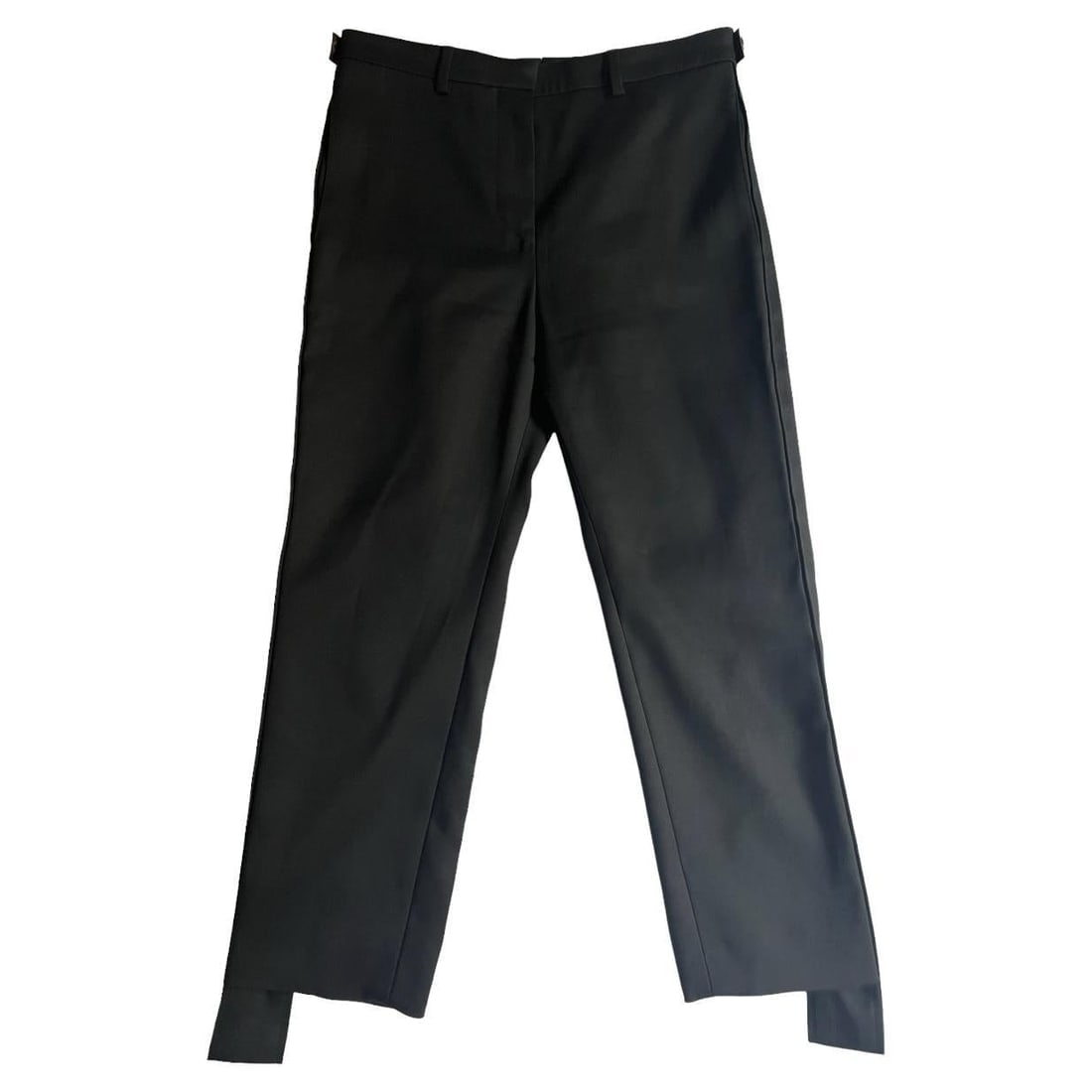 Louis Vuitton Black Trousers Pants, Size 38: Mid waist raise Strait leg fit Side pockets & rare side pockets Leather logo detail on the sides Reserve: $600.00 Shipping: Domestic: Flat-rate of $85.99 to anywhere within the contiguous U.