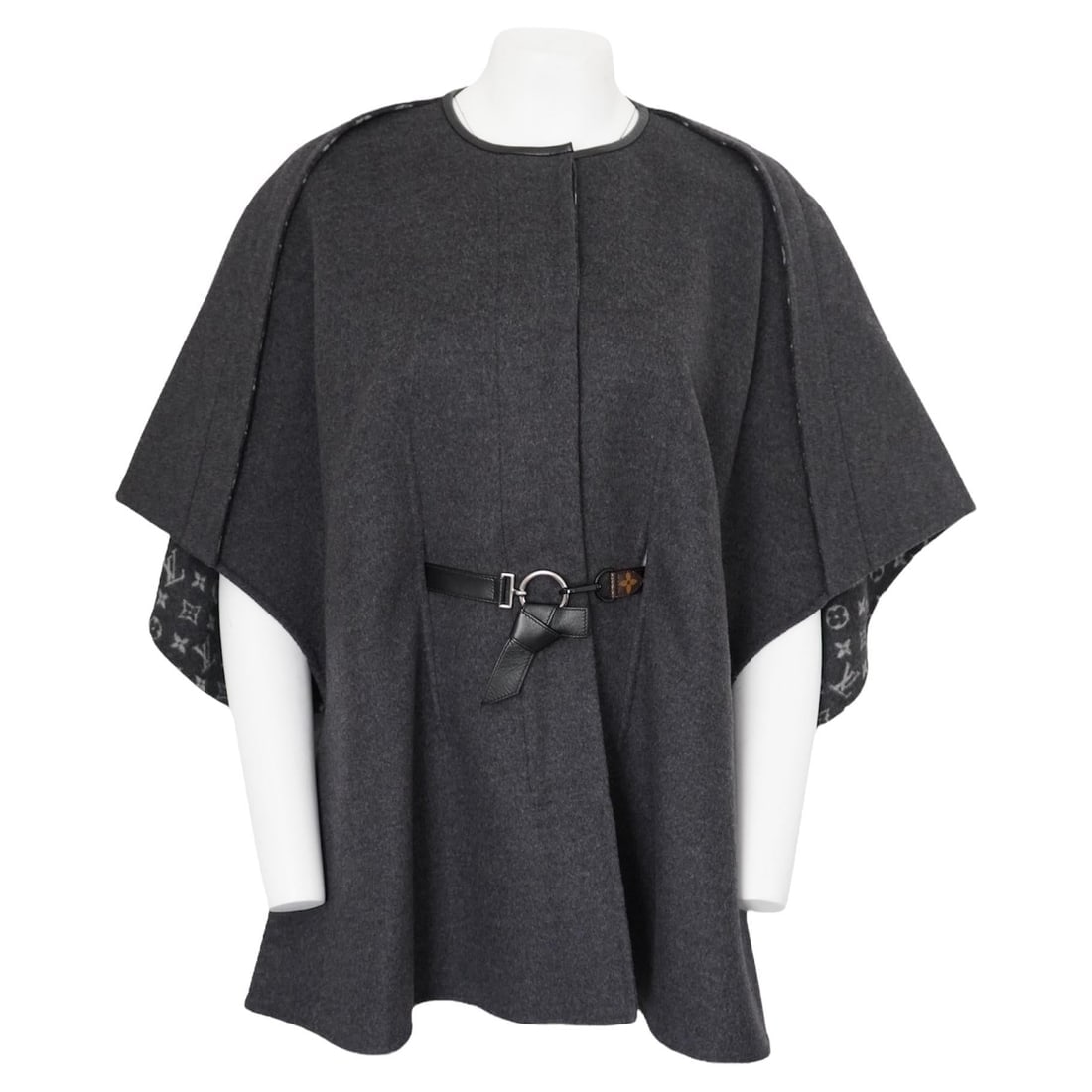 Louis Vuitton Monogram Grey Buttoned Wool Cape Coat: Louis Vuitton LV Monogram cape coat is an absolute winter classic. Light but warm and luxurious wool (99% Wool, 1% Silk). Plain gray exterior and LV monogram inside. This coat has hidden button