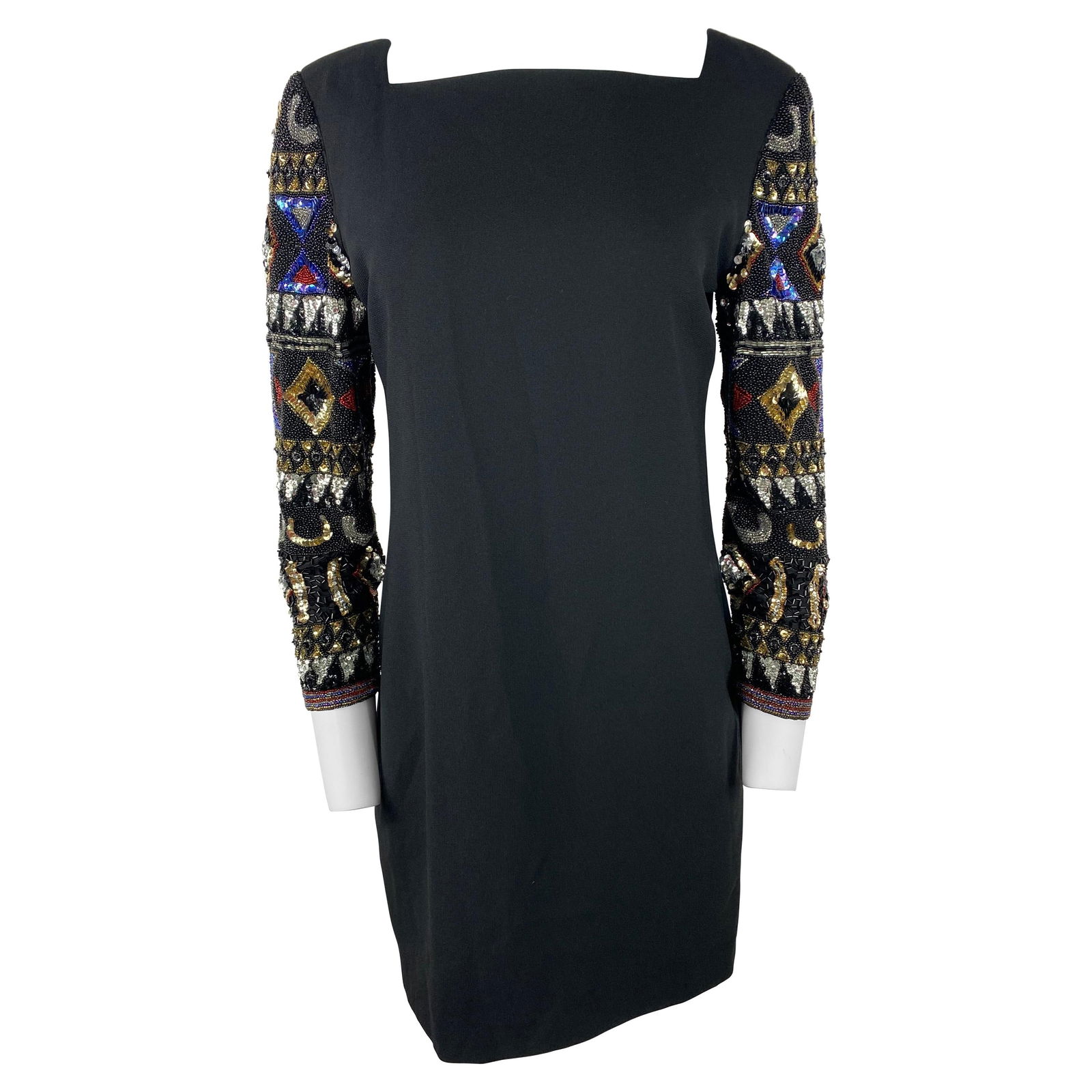 I. Magnin Black Mini Evening Dress: Product details: The dress features mini length, long sleeves with multicolored rhinestones design, rear zip closure. Reserve: $632.00 Shipping:Domestic: Flat-rate of $85.99 to anywhere