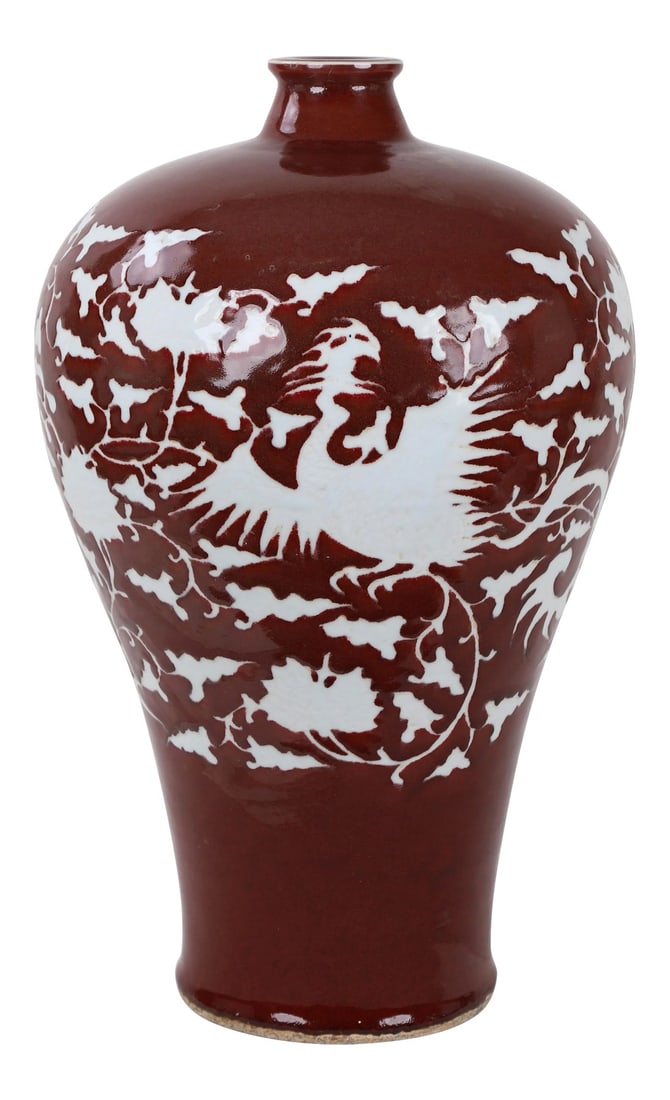 Early 20th-Century Chinese Red-Glazed Vase With Carved White Phoenix and Floral Motifs.: Early 20th-century Chinese red-glazed vase with carved white phoenix and floral motifs. Condition: Alterations: Original Condition Unaltered Imperfections: Some Imperfections Condition Notes: