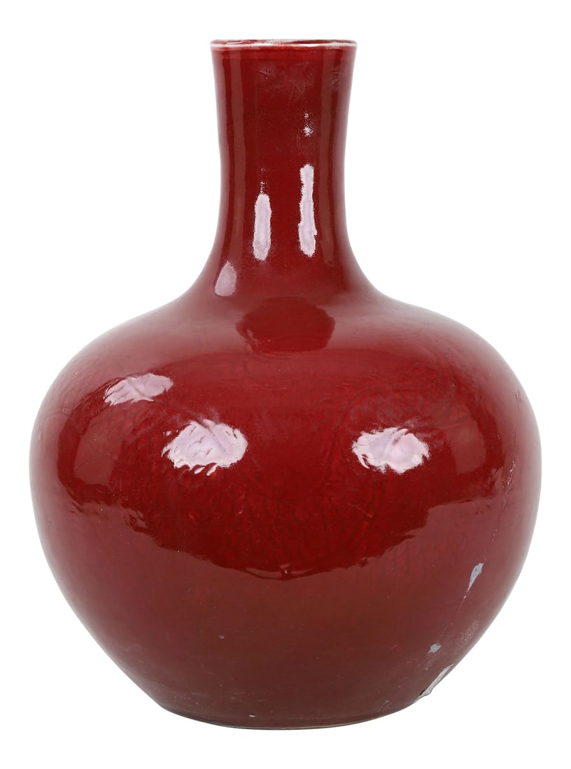 A 20th-Century Chinese Red-Glazed Dragon-Patterned Lestial Globe Vase (Restored): This vase is glazed in a red that allows subtle relief detail to be seen. Has some damage, big crack . Condition: Alterations: Restored Imperfections: Some Imperfections Condition Notes: Crack