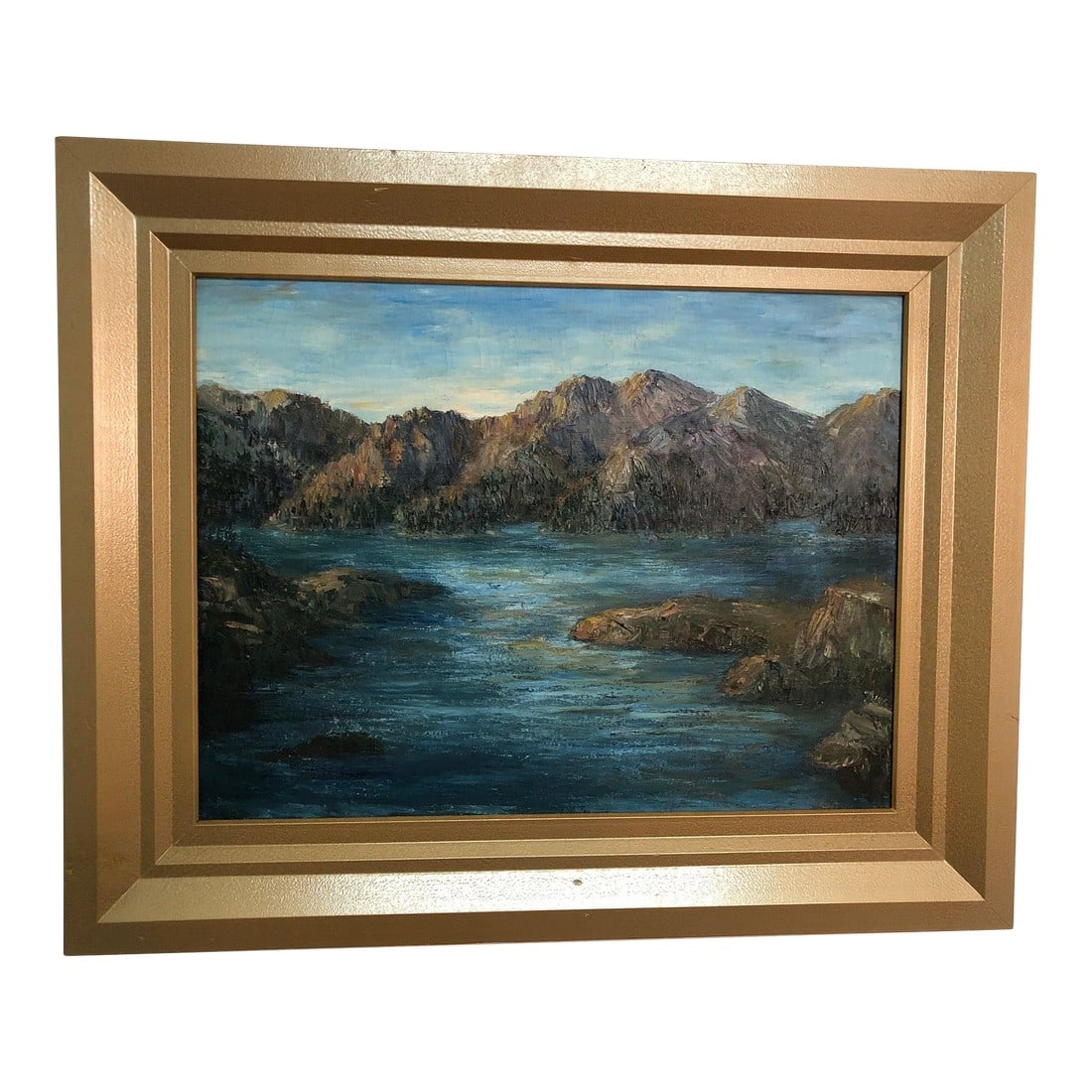 Mid 20th Century River and Mountains – Original Oil on Canvas: This original oil painting on canvas depicts a serene landscape of detailed mountains and a flowing river or sea area. The composition captures the majesty of nature, with intricate brushwork