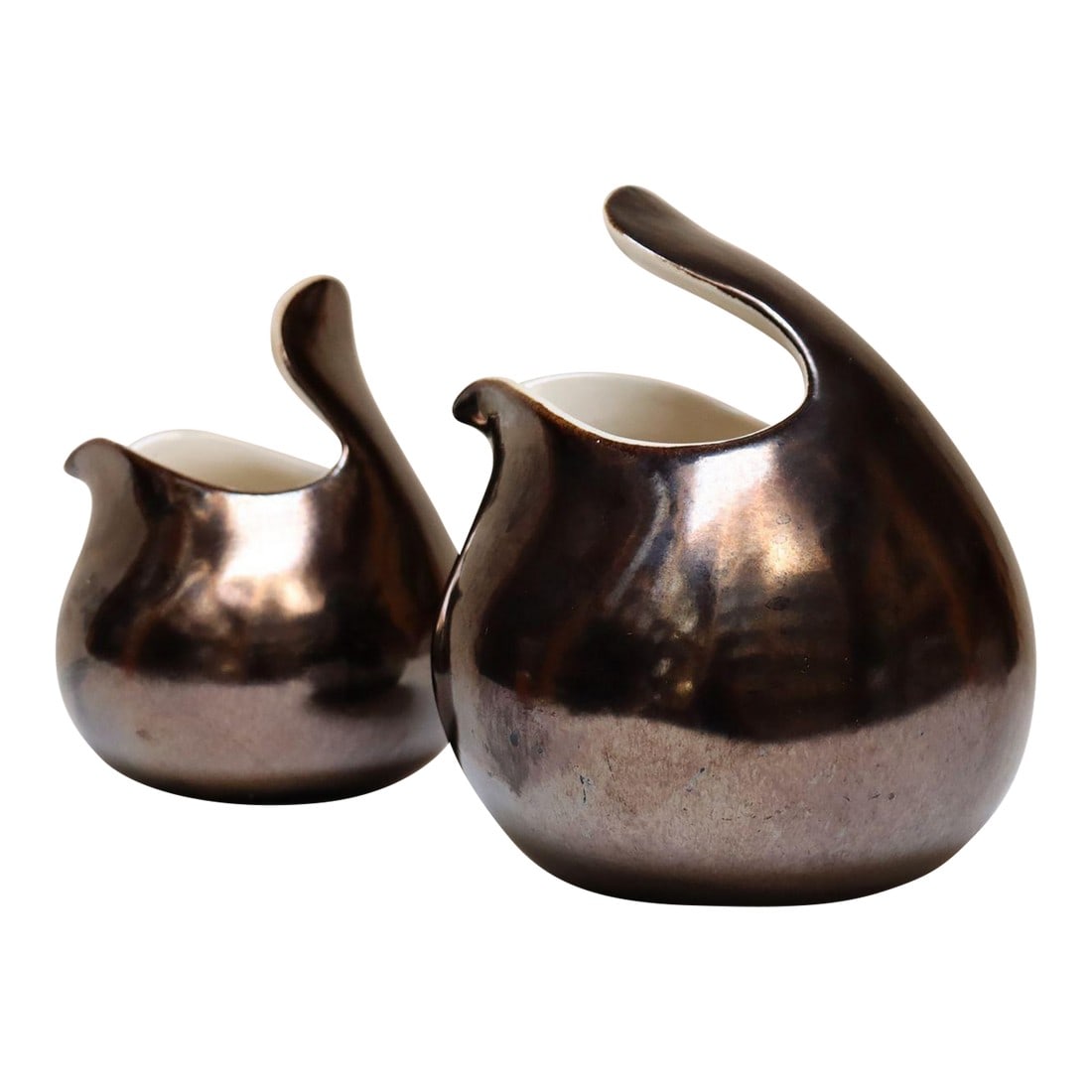 Set of Two Vintage Eva Zeisel Ceramic "Town and Country" Pitchers for Red Wing: Set of two (small and large) Eva Zeisel gunmetal gray glazed ceramic earthenware "Town and Country" pitchers for Red Wing Pottery (ca. 1947, Minnesota, USA). "Town and Country," perhaps Zeisel's most