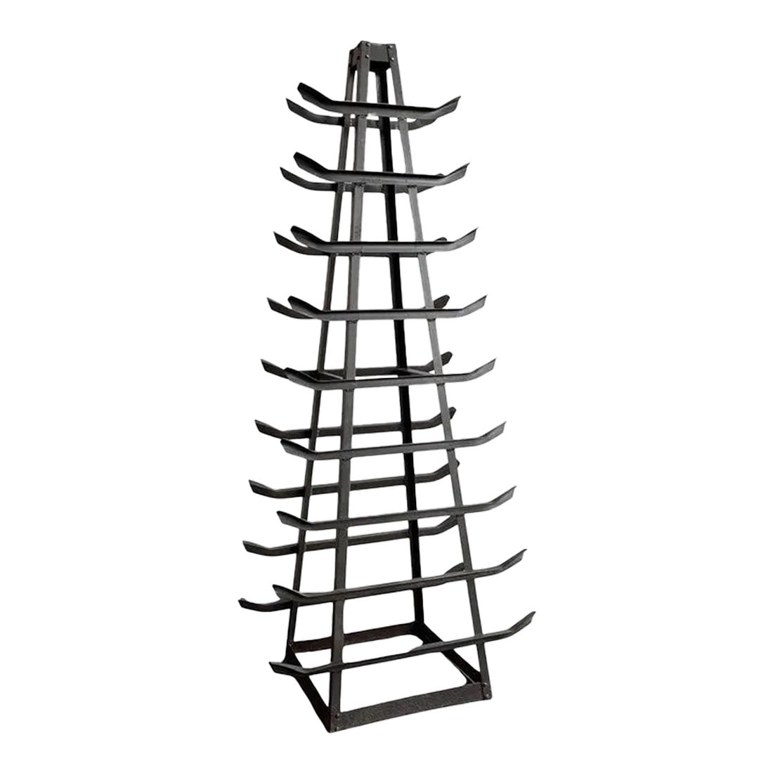 1940s Custom-Made Tall Industrial Cast Iron Tower Storage Rack Sculpture: This custom-made Industrial tall cast-iron tower features 9 levels of upturned racks that taper to 22 inches x 8 inches on the top rack. The tower is a unique industrial storage piece, that was