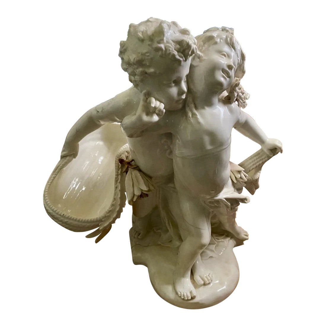 Early 19th Century Antique Sevres Style Putti Statue: Beautiful Very Large Sevres Style Putti Statue. Probably German Rococo Revival No restoration attempts have been made on this statue. It could either be restored or valued for its beauty as is. 