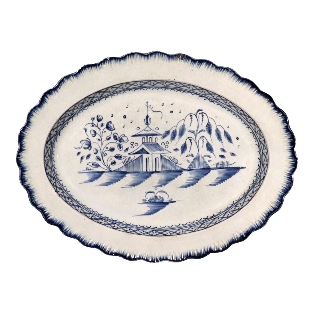 Pagoda Paradise: Rare English Pearlware Shell-Edged Dish in Blue Chinoiserie: Pagoda Paradise: Rare English Pearlware Shell-Edged Dish in Blue Chinoiserie Discover a charming piece of early 19th-century ceramic history with this large, beautifully stylized English Pearlware